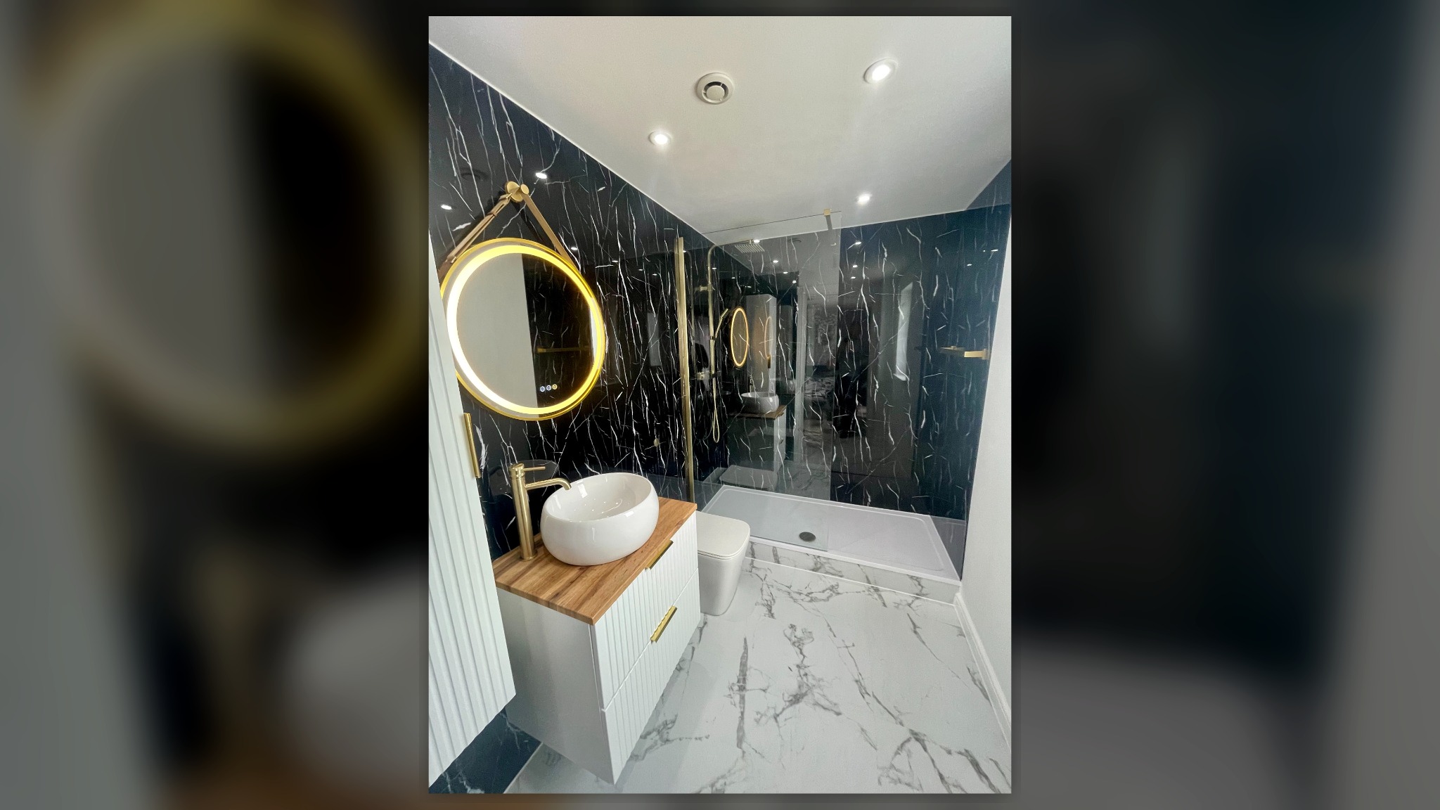 Luxury black marble bathroom with gold fittings